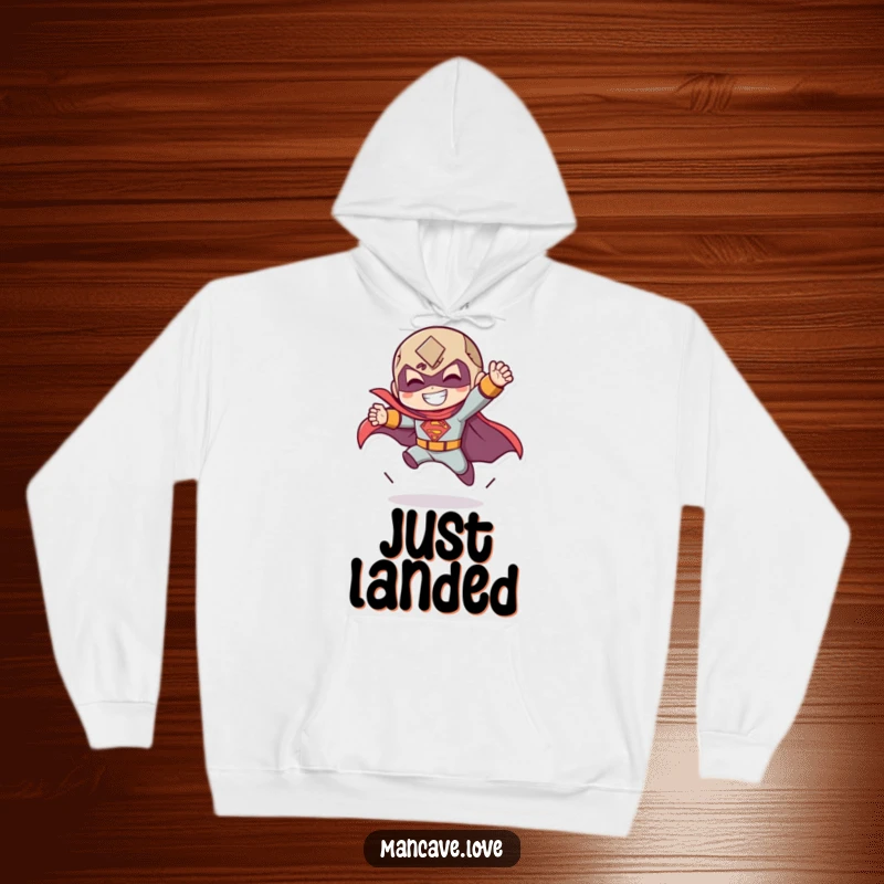 Funny hoodie with a character in a dramatic superhero landing pose with a grin, ideal for cozy heroism.